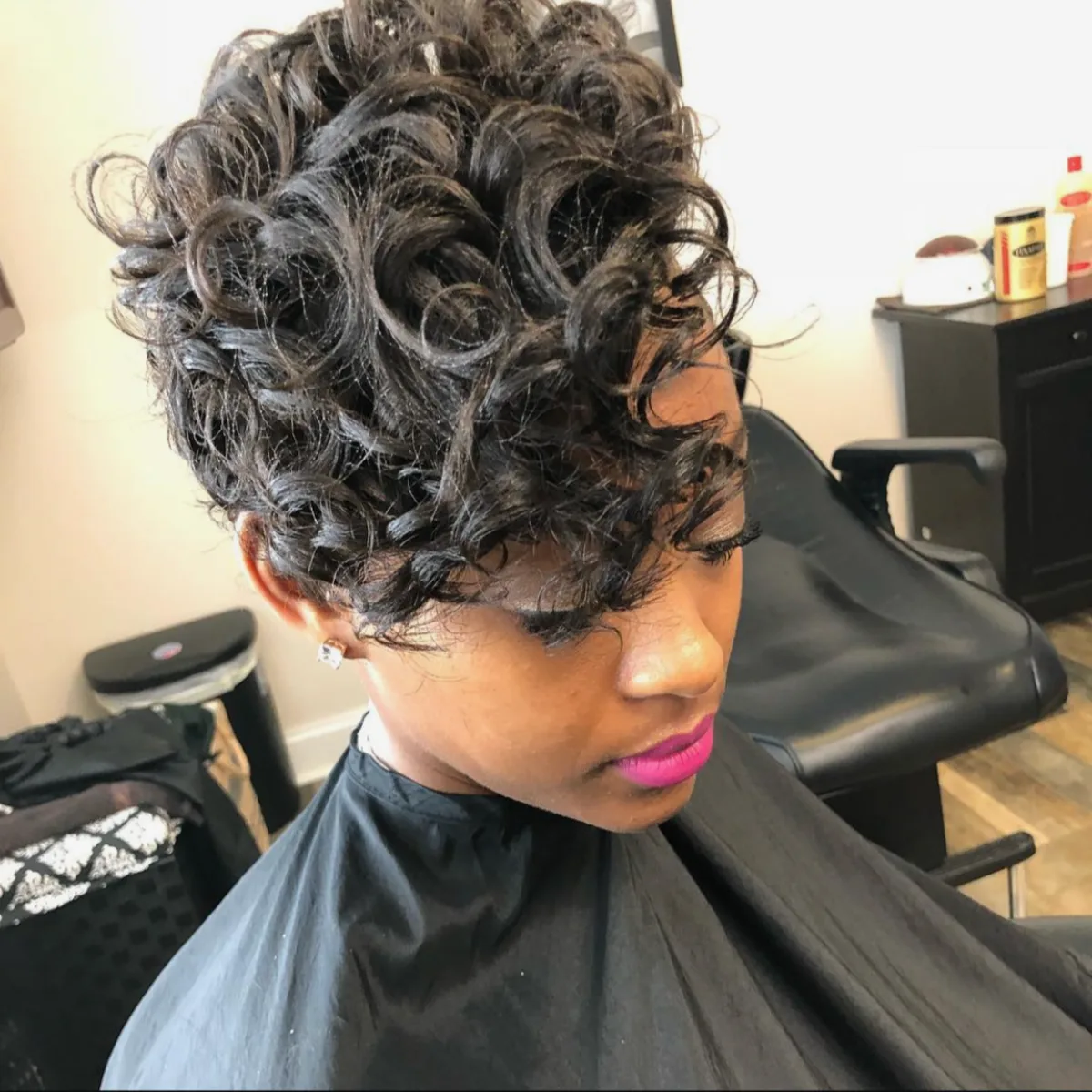 Sleek pixie cut with side parting and shine