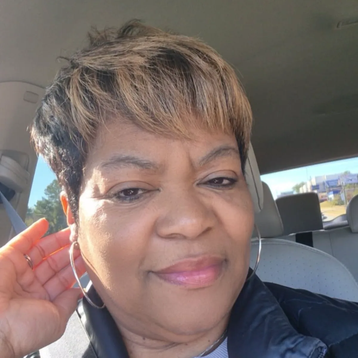 Textured pixie haircut with highlights and waves