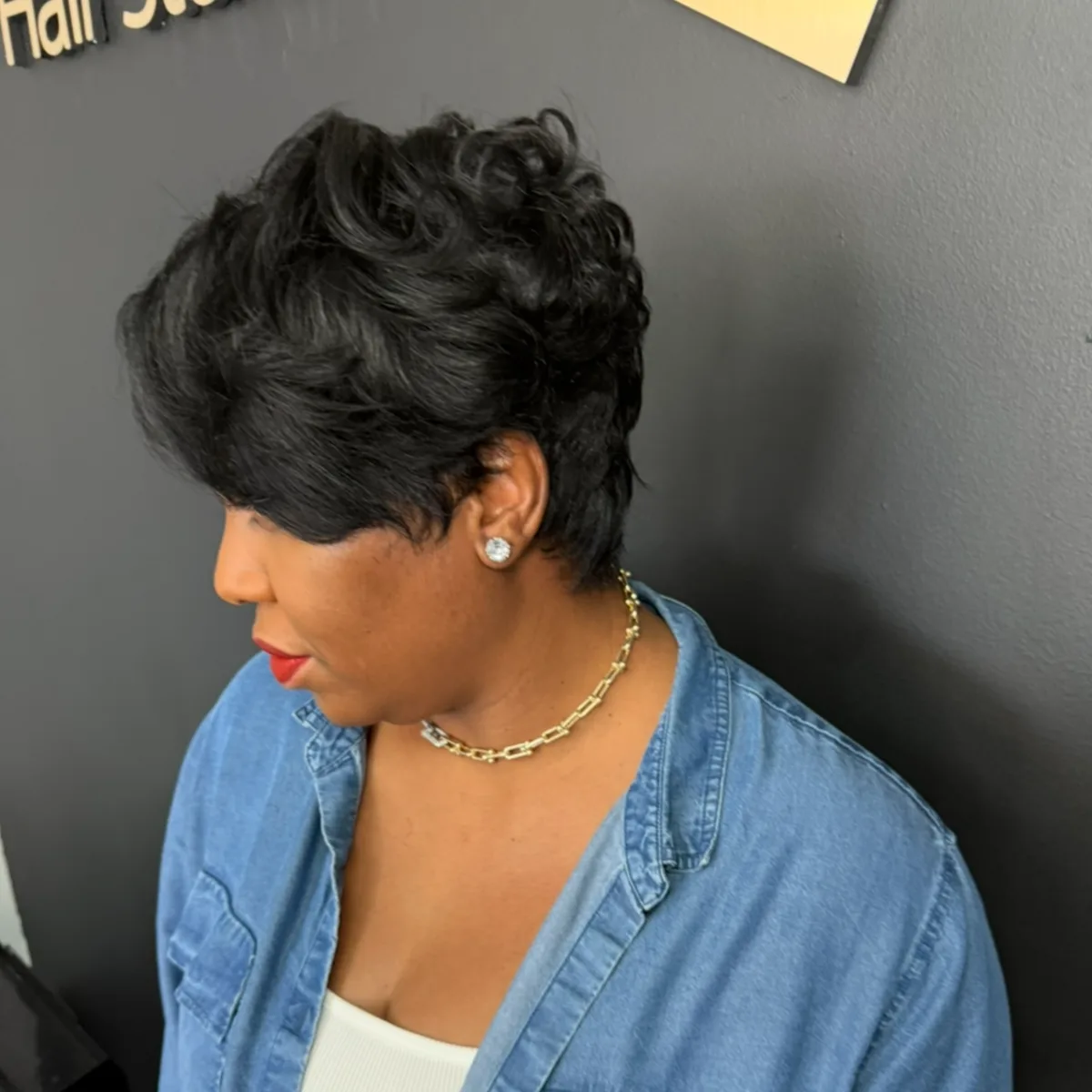 Sleek short hairstyle styled straight for elegance